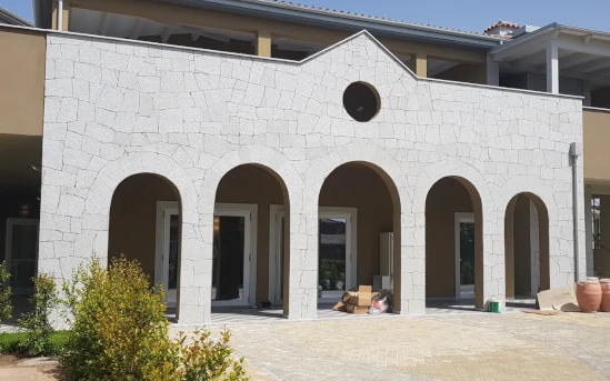 Granite building covers P.I.L.Gran min