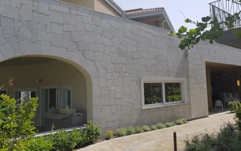 Granite building exterior P.I.L. Gran min