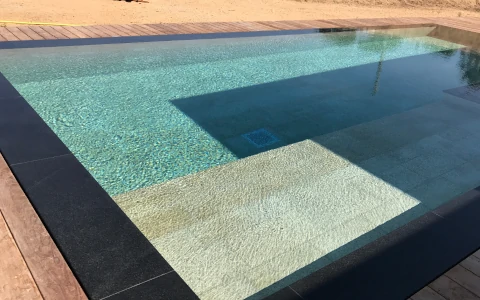Black granite swimming pool covering P.I.L. Gran min